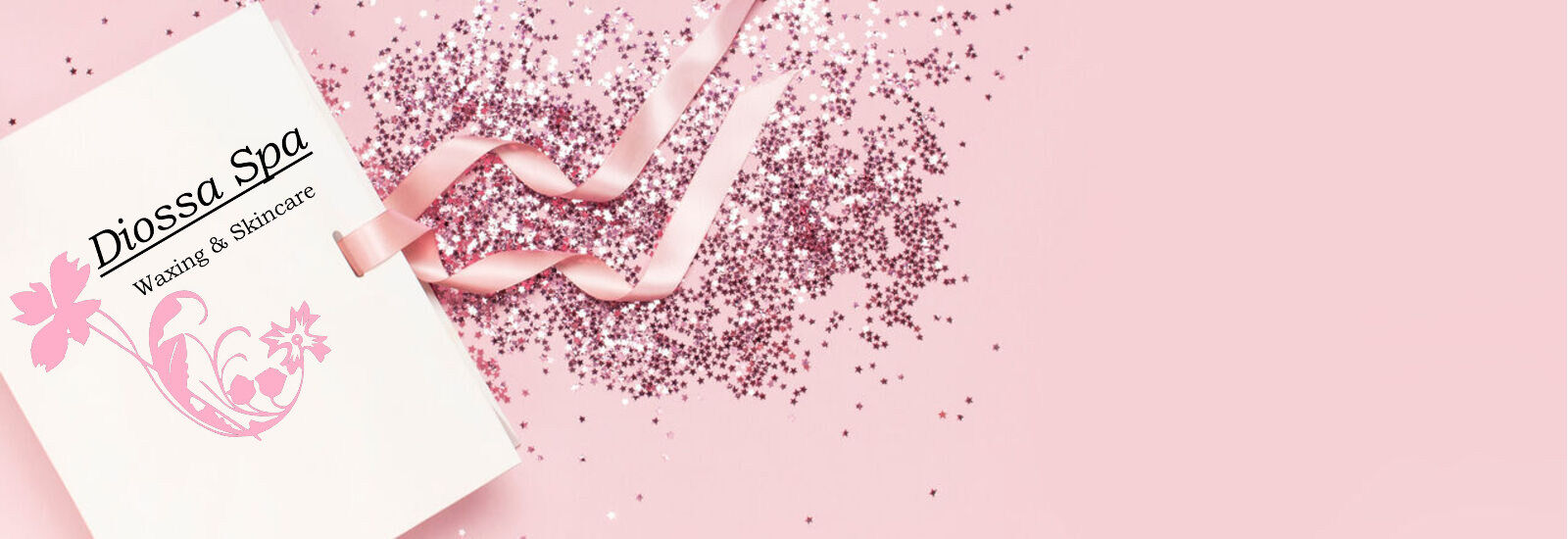 gift card surrounding by pink glitter on a pink background